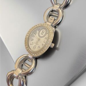 Gorgeous Daisy Fuentes women’s wristwatch bling excellent condition runs…